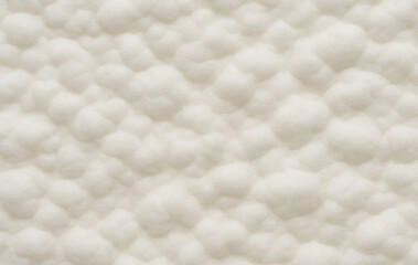 Abstract texture featuring rounded, cloud-like, off-white forms in a repeating pattern.