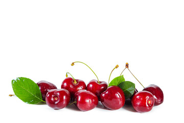 Ripe juicy cherry with  leaves isolated on white background.
