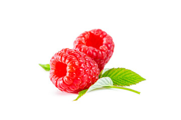 Ripe shiny raspberries with leaves isolated on white background.