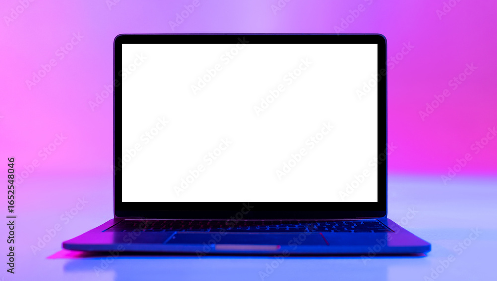 Poster laptop computer with blank white screen in neon light, mockup for desktop or website. modern portabl
