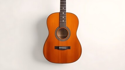 Obraz premium Acoustic guitar placed on a white surface with studio lighting from a 45-degree angle.