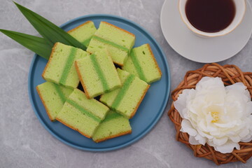 Delicious Pandan Layer Cake Slices on a Blue Plate