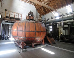 Large wooden fermenter in a historic distillery