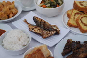 Delicious Indonesian Cuisine A Culinary Spread of Grilled Fish, Rice, and Sides