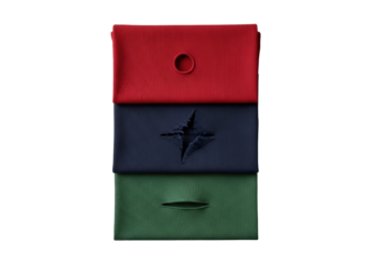 Stacked ruby red, navy, forest green t-shirt fabric swatches with unique cuts and tears, showcasing soft texture & knit pattern, on seamless transparent studio background with diffused lighting,