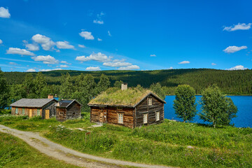 typical swedish log hut or cabin in the woods.
