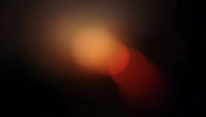 grainy colorful warm orange light leaks on black background with dust texture. abstract damaged scratched retro film analog effect for using over photos as overlay or screen filter