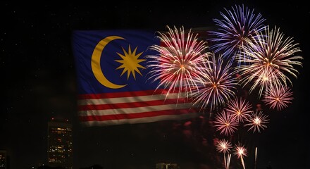 Naklejka premium Vibrant fireworks display on Malaysia Independence Day against a dark night sky with the Malaysian flag