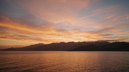 Fototapeta premium Scenic twilight with mountain silhouettes and colorful clouds