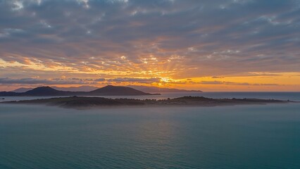 Fototapeta premium Early Morning Light on a Secluded Shore