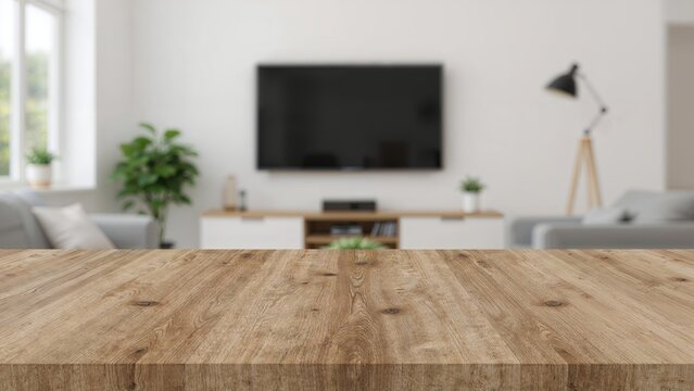 Light wood surface in front of a softly blurred interior, ideal for showcasing items.