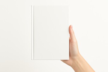 Hand of a female holding a blank-covered book on a white background