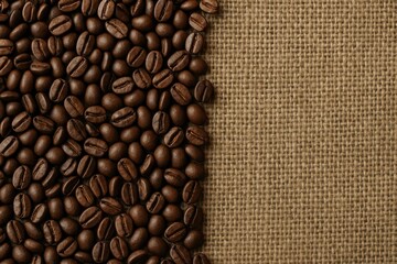 Fototapeta premium Close-up of coffee beans atop a coarse jute bag