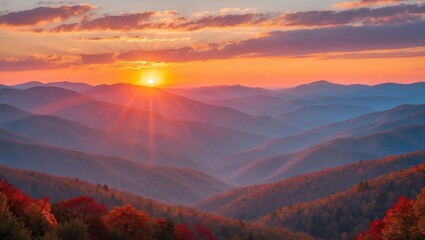 Fototapeta premium Bright autumn sunrise casting hues on the scenic mountain landscape