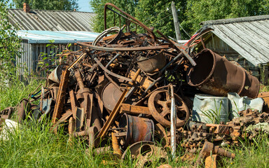 a pile of rusty iron on the grass