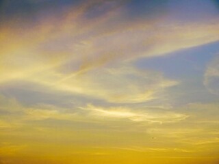 Fototapeta premium The colors of the morning blend in a harmony of gold and blue.