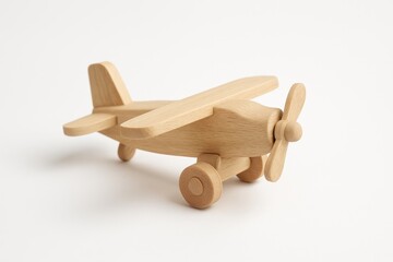 Conceptual image of a wooden aircraft toy against a white background.