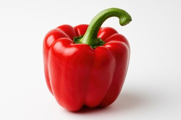 A lone red bell pepper on a clean white surface