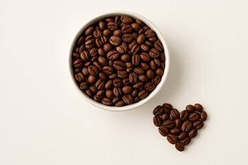 Fototapeta premium A bowl filled with coffee beans against a light backdrop