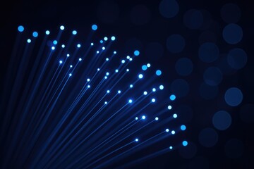 Vivid blue optical fiber strands glowing in the dark