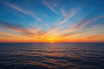 Fototapeta premium A breathtaking scene of the sea under a wide, colorful sky, forming a stunning natural artwork.
