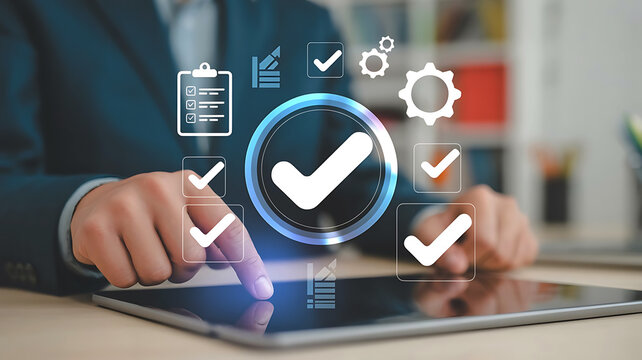 Business professional reviewing data and confirming tasks with digital checkmarks and quality control icons on a tablet