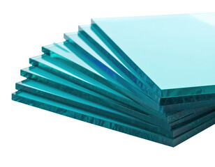 A fanned stack of thick transparent rectangular glass panes with a distinct greenishblue tint.