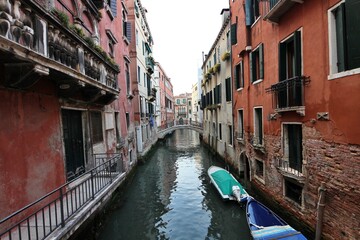 Morning view of the old town, canal and old bridge in the San Marco district of Venice, Italy