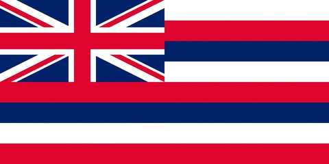 Hawaiian flag waving proudly against a clear blue sky