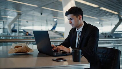 Business traveler working at airport lounge during layover