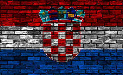 Vibrant mural of Croatian flag on a textured brick wall