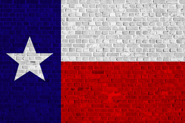 Vibrant Texas flag mural on a brick wall showcasing state pride © Jelena