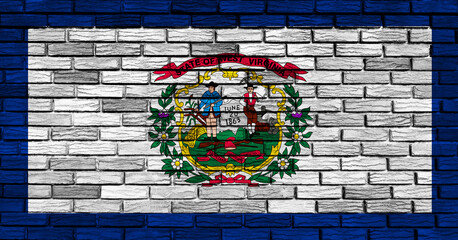 West Virginia state flag painted on brick wall in vibrant colors