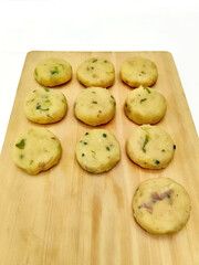 Rows of Raw Potato Fritters Patties