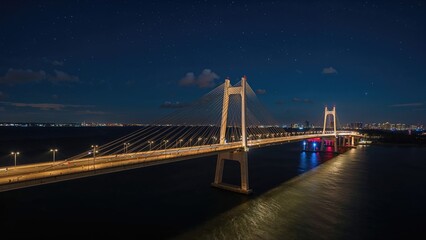 Fototapeta premium Evening scene of a long bridge carrying highways over a large bay