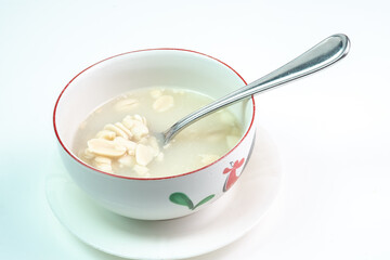a bowl of huāshēng tángshuǐ or Wedang Kacang, a popular dessert in Southeast Asia with Chinese-Peranakan influences. The warm sweet soup, with a base of blanched