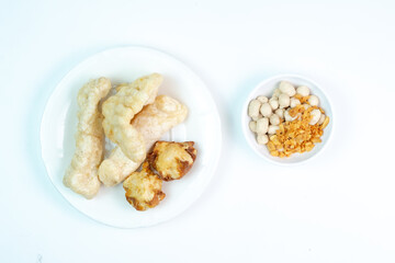 Cuankie is a popular Indonesian street food from Bandung, West Java. type of bakso (meatball soup) distinguished by its pre-fried, dry components like fish balls and tofu, served by adding hot  water