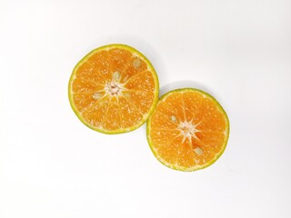 Fresh orange fruit cut in half, isolated on white background. Citrus photography, healthy tropical fruit, vitamin C, natural food, diet and nutrition concept.