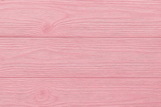 Wooden-textured background featuring pink paint in an abstract style