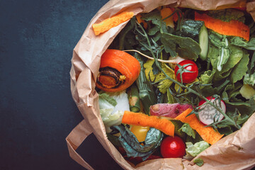 Zero waste concept. Food trash in recyclable paper bag for compost. Sustainable lifestyle, plastic free