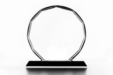 Blank crystal glass award trophy on white background with copy space, elegant transparent plaque...