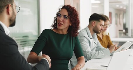 Middle-aged female manager provides professional consultation to client, shaking hands, expressing satisfaction for negotiations outcome, sell company services, reach agreement. Business, transaction - Powered by Adobe