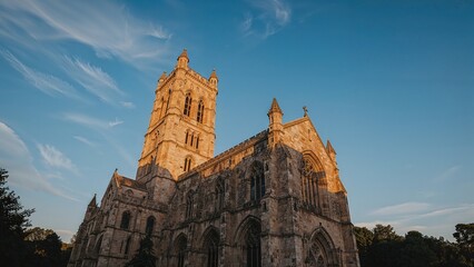 Fototapeta premium Grand cathedral spire soaring into the blue sky