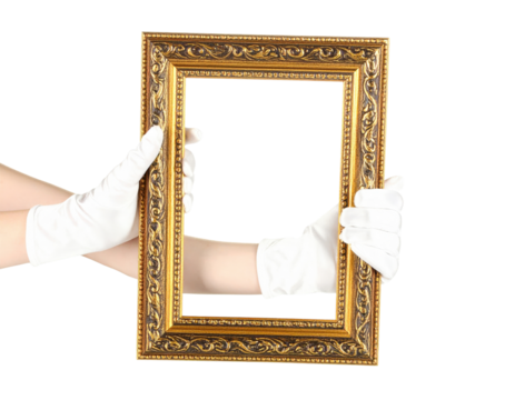 Hands in white gloves presenting an empty ornate vertical gilded picture frame with intricate carvings.