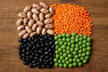 Fototapeta premium Detailed view of beans on a wooden table against a soft backdrop