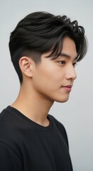 Young Man with Stylish Haircut in Black T-Shirt - Profile View