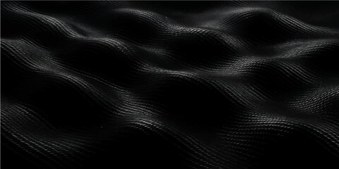 Black satin and silk fabric background with smooth flowing texture and elegant design