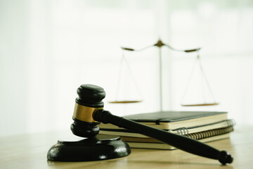 A gavel on a desk represents law, justice, and authority, symbolizing courtroom judgment, legal...