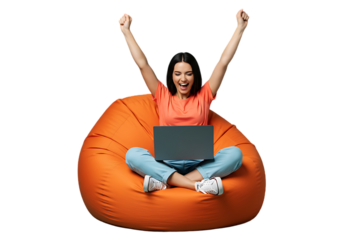 Excited young woman celebrating success with laptop on bean bag isolated on transparent background