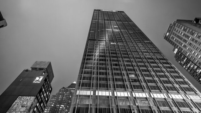 New York City - June 14, 2025: Nighttime view of busy Times Square streets illuminated by colorful billboards and city lights